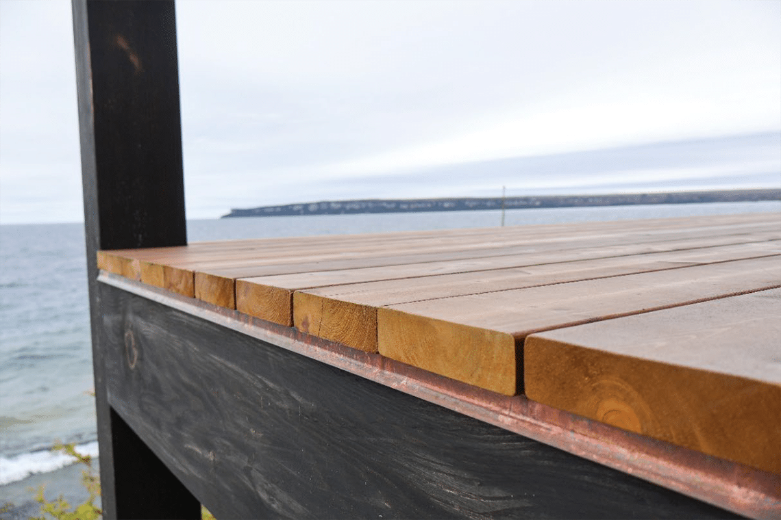 End Grain is coated with Sansin Dec preventing moisture absorption. Copper flashing is used to prevent water damage.